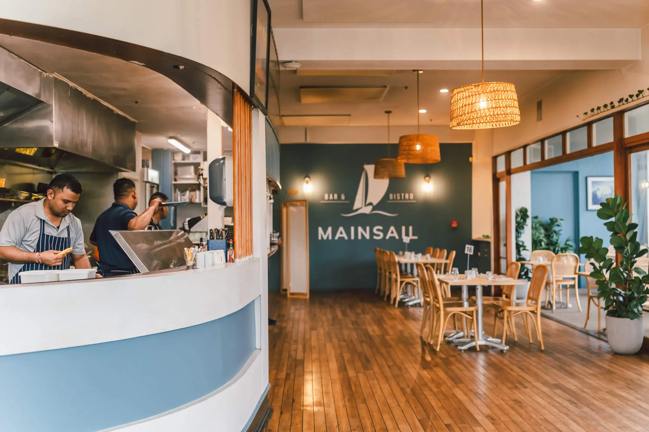 Mainsail dining interior and bar with timber flooring