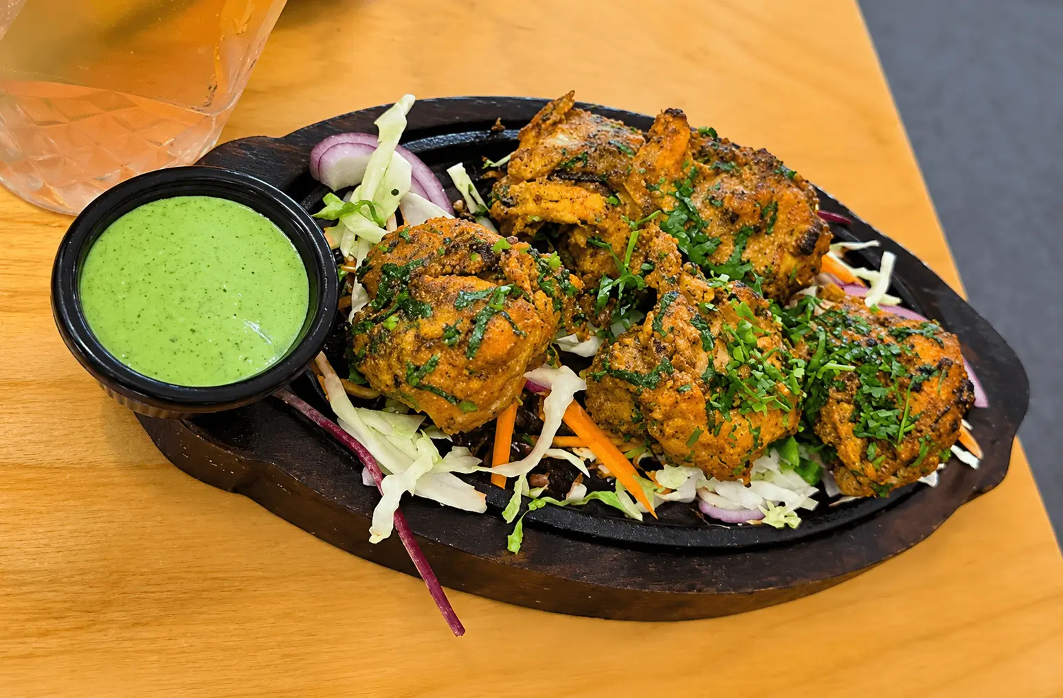 Food platter with grilled starters and dipping sauce