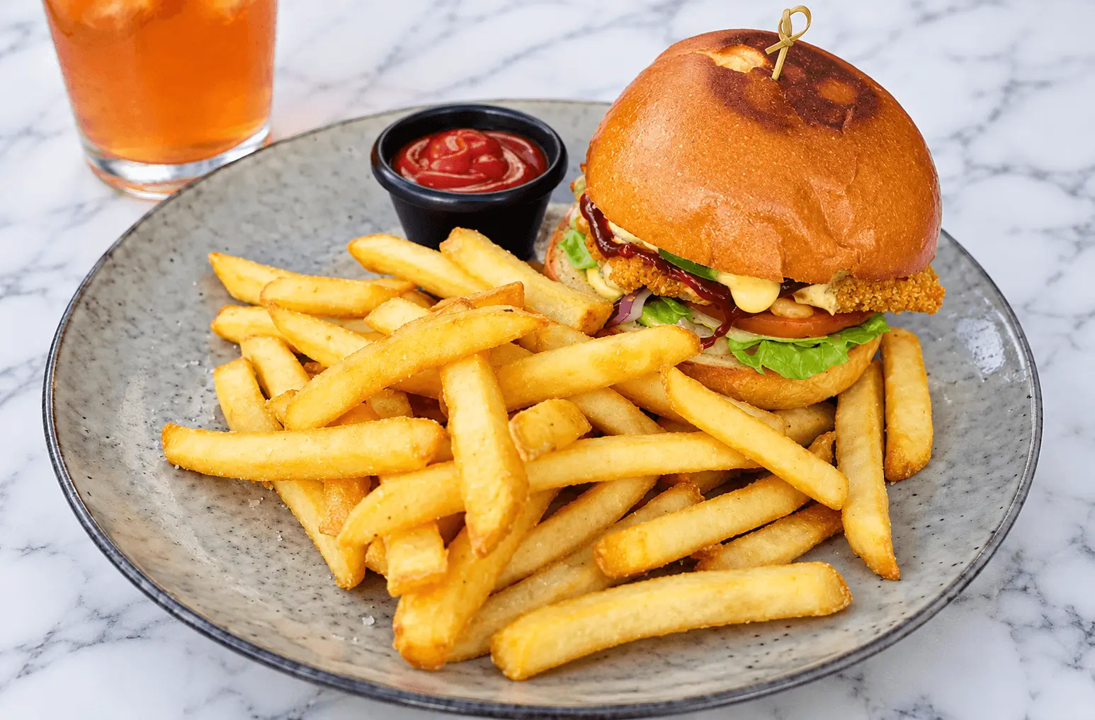Burger and fries served with dipping sauce